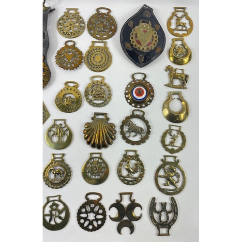 481 - A box of 41 HORSE BRASSES  to include 2 mounted on leather, one inscribed 