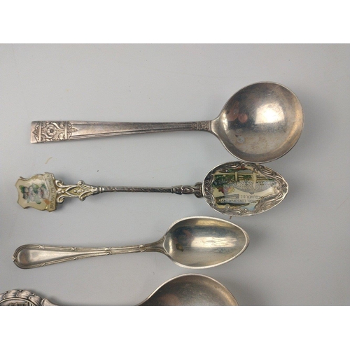 483 - A small collection of white metalware to consist of collector's spoons from around the world includi... 