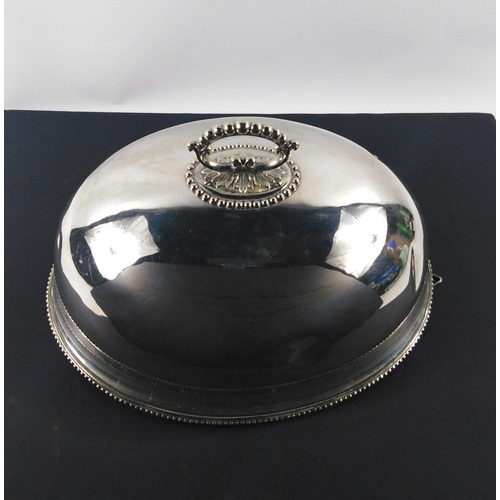 484 - A medium sized vintage white metal domed meat cover 37cm long and approx 25cm high, surface has a fe... 