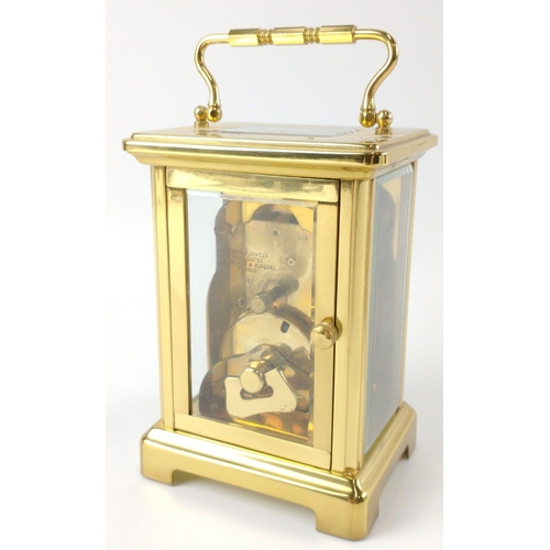 51 - A quality BAYARD French gilt brass and glass 8 day carriage clock with a white surface with black pa... 