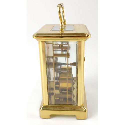 51 - A quality BAYARD French gilt brass and glass 8 day carriage clock with a white surface with black pa... 