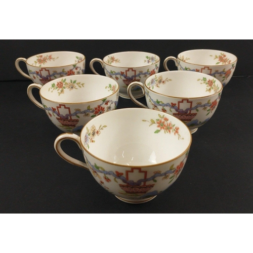 96 - A ROYAL WORCESTER tea set c 1922 to include 12 cups, 11 side plates, 2 cake plates, 12 cups and sauc... 