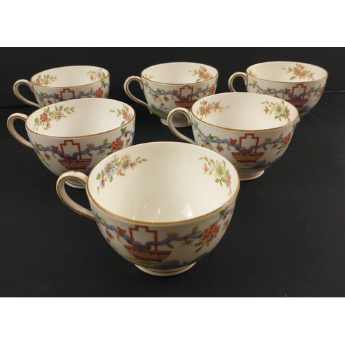 96 - A ROYAL WORCESTER tea set c 1922 to include 12 cups, 11 side plates, 2 cake plates, 12 cups and sauc... 