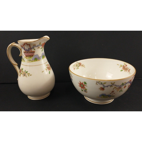 96 - A ROYAL WORCESTER tea set c 1922 to include 12 cups, 11 side plates, 2 cake plates, 12 cups and sauc... 