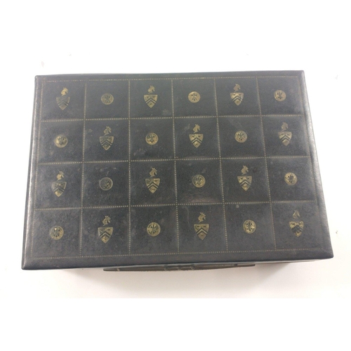 27 - A black leather jewellery case, lined with red velvet with 2 swing out sections, holding a large sel... 