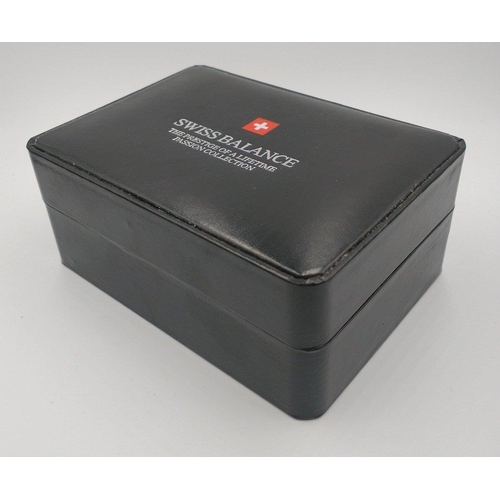 30 - SWISS BALANCE wrist watch in presentation case. Has black face (20mm wide approx) with metal dots at... 