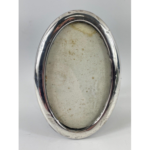 37 - Two oval shaped Birmingham, 1926, hallmarked photo frames gross weight 198gms#42