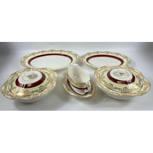 48 - A STAFFORDSHIRE MID-WINTER semi-porcelain dinner service for 6 in cream with gilt edging and a burgu... 