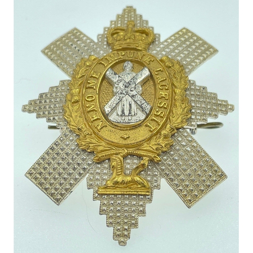 101 - An officer's CAP BADGE queen's Crown, BLACK WATCH#102