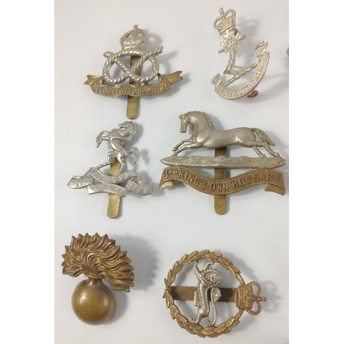 106 - Twelve British military cap badges to include the 3rd KING'S OWN HUSSARS, ROYAL WEST, DURHAM LIGHT I... 