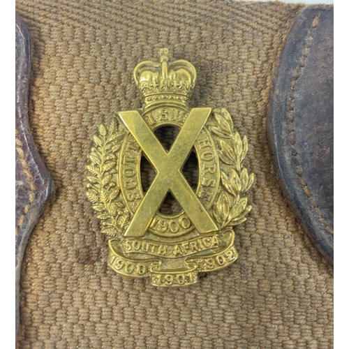 113 - A WWl belt with 15 badges and buttons including SCOTTISH HORSE, ROYAL ARMY MEDICAL CORPS, ARGYLL AND... 