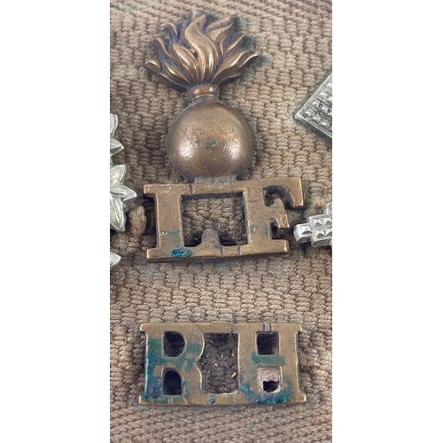 113 - A WWl belt with 15 badges and buttons including SCOTTISH HORSE, ROYAL ARMY MEDICAL CORPS, ARGYLL AND... 