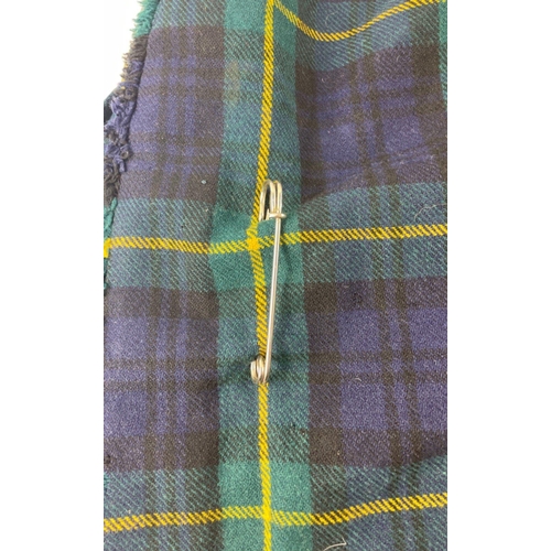 119 - A GORDON HIGHLANDER'S officer's kilt (59cm length), kilt pin, leather day sporran with regimental ba... 