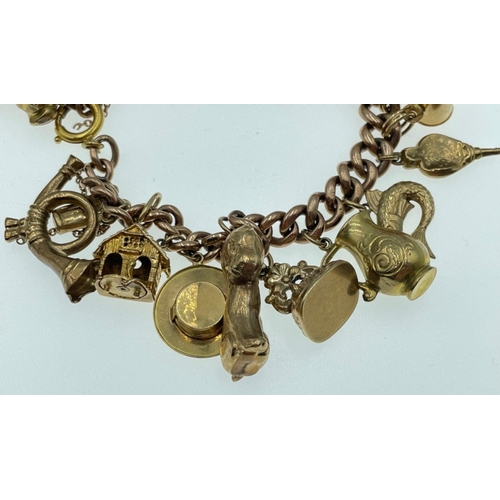 12 - LOTS OF CHARMS!A 375 stamped gold charm bracelet , the 375 is partially rubbed, with most charms sta... 