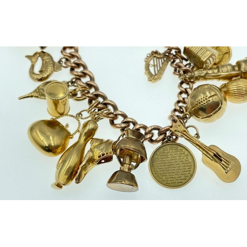 12 - LOTS OF CHARMS!A 375 stamped gold charm bracelet , the 375 is partially rubbed, with most charms sta... 