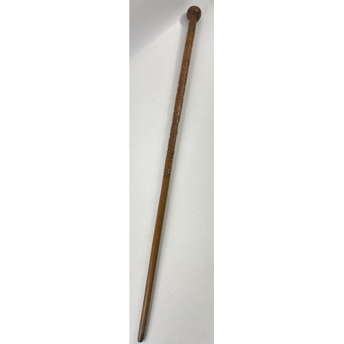 139 - A rather fine WWl carved walking stick 90cm long#142