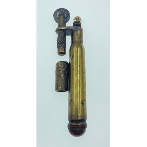 146 - Two examples of TRENCH ART LIGHTERS, the first being WWl brass and the second being post-WWll white ... 