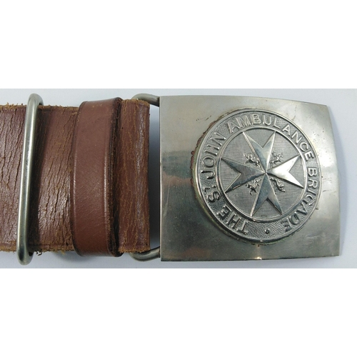 157 - A WW2 St John's Ambulance belt and buckle and FIRST AID leather pouch complete with its  First Aid t... 