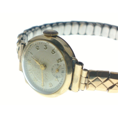 57 - A vintage JNO ladies 375 gold stamped cased yellow gold wrist watch with a rolled gold expanding bra... 