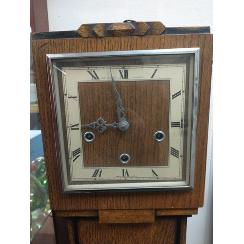 66 - Granddaughter clock by Mark Hutchings, Winchester in the Art Deco style with square dial and Roman n... 