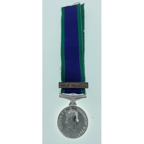 94 - A British Service medal with ribbon for MALAYA complete with its original presentation display case ... 