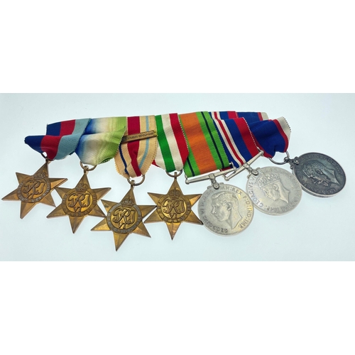 96 - A MEDAL GROUPING belonging to Signaller Smith, to include The ROYAL NAVAL RESERVE LONG SERVICE GOOD ... 