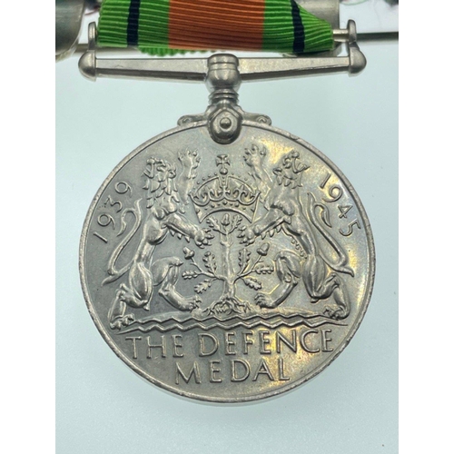 96 - A MEDAL GROUPING belonging to Signaller Smith, to include The ROYAL NAVAL RESERVE LONG SERVICE GOOD ... 