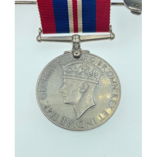 96 - A MEDAL GROUPING belonging to Signaller Smith, to include The ROYAL NAVAL RESERVE LONG SERVICE GOOD ... 