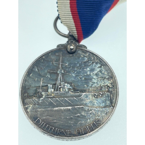 96 - A MEDAL GROUPING belonging to Signaller Smith, to include The ROYAL NAVAL RESERVE LONG SERVICE GOOD ... 