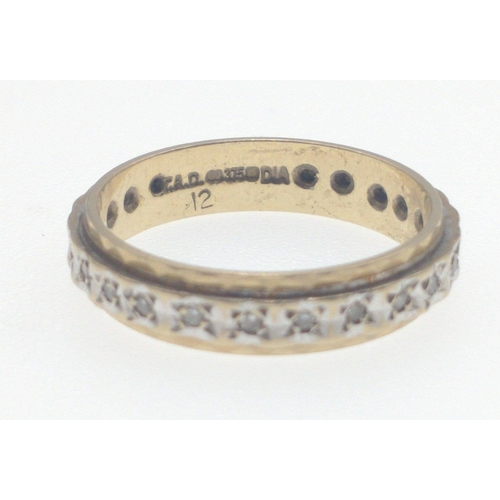 3 - A 375 stamped yellow gold ring size K/L studded with diamante sparking pieces all the way round the ... 