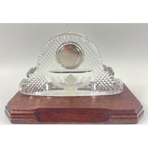 72 - EDINBURGH CRYSTAL - a small glass mantle clock complete with plinth - dimensions 15cm length x 9cm h... 