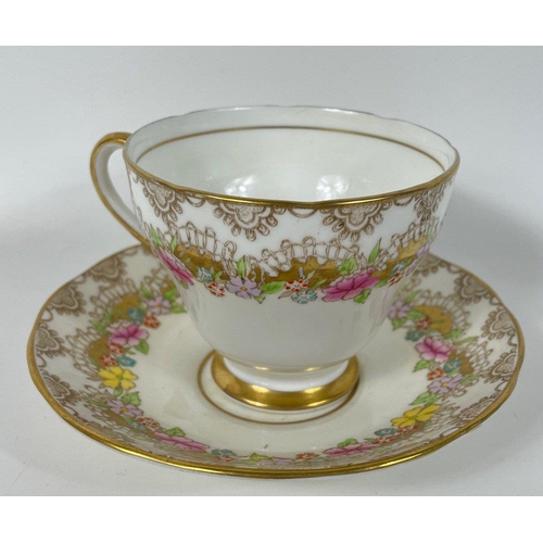 101 - A SALISBURY APRIL hand-decorated part tea service comprising 5 teacups, 7 saucers, 10 side plates, 2... 