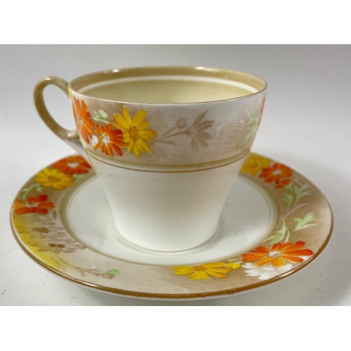 103 - A vintage ART DECO SHELLEY part tea service, pattern no 12496 with orange and yellow dahlias, compri... 