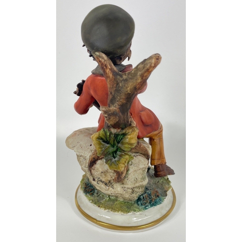 149 - Four CAPO DI MONTE figurines of boys engaged in various activities (tallest is 17cm )#176