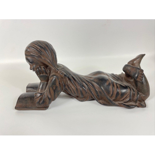 233 - A composite/bronzed figurine of a girl reading 35x18cm high#285