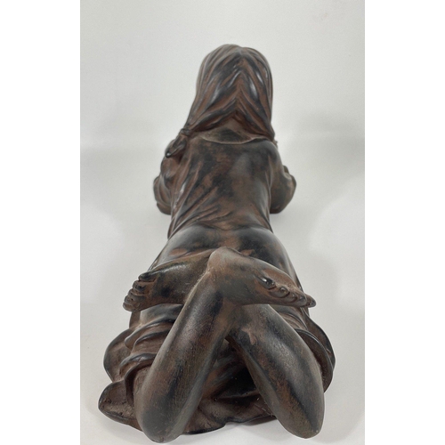 233 - A composite/bronzed figurine of a girl reading 35x18cm high#285