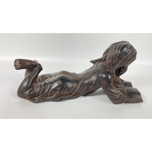 233 - A composite/bronzed figurine of a girl reading 35x18cm high#285