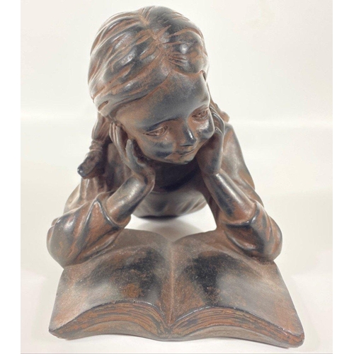 233 - A composite/bronzed figurine of a girl reading 35x18cm high#285