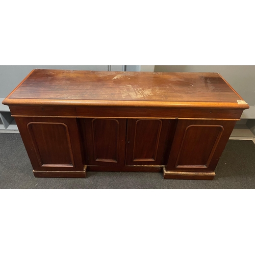 304 - A VICTORIAN solid Mahogany sideboard with three drawers, and three cupboards - the top has sustained... 