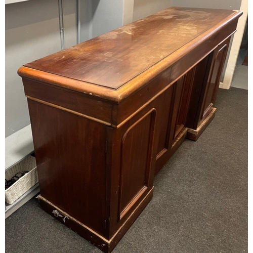 304 - A VICTORIAN solid Mahogany sideboard with three drawers, and three cupboards - the top has sustained... 