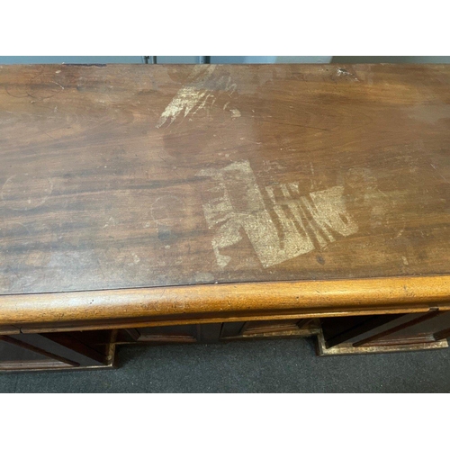 304 - A VICTORIAN solid Mahogany sideboard with three drawers, and three cupboards - the top has sustained... 