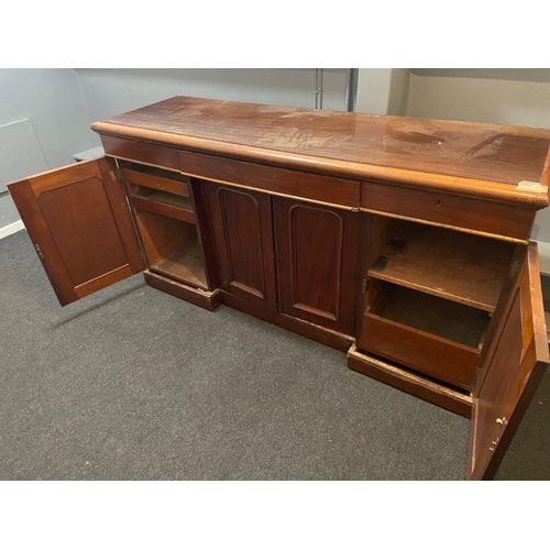 304 - A VICTORIAN solid Mahogany sideboard with three drawers, and three cupboards - the top has sustained... 