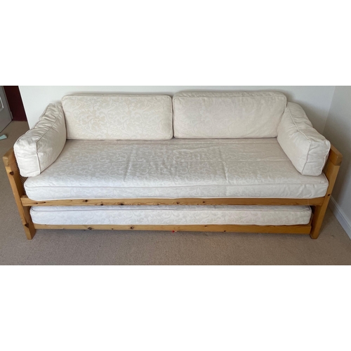 306 - A nice cream upholstered and pine framed bed seater with pull-out framed mattress / 7ft wide x 6ft d... 