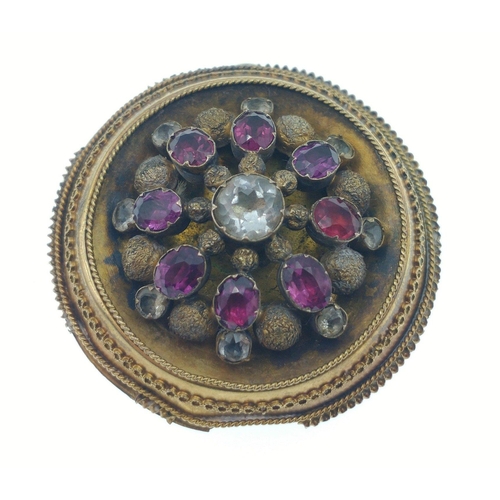 30A - A VINTAGE c1890's 'yellow metal' brooch with amethyst style stones, one being replaced at one point ... 