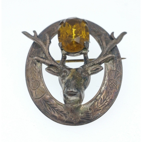 31 - A Scottish Silver Hallmarked brooch, Edinburgh 1930, with antlers and a semi-precious stone 4.5cm, g... 