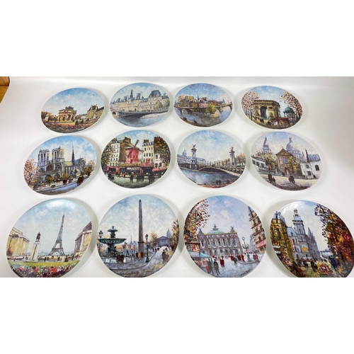 388 - Twelve limited edition LIMOGES collectors' plates with Parisian scenes to include L'Arc de Triomphe,... 