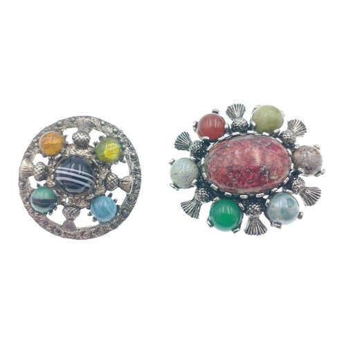 39 - Two vintage Scottish brooches with thistles and semi-precious stones, 1 round (4cm dia) and 1 oval (... 