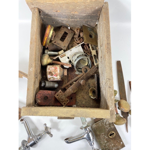 411 - An old wooden box full of 'ANY OLD IRON' , antique brass door handles, taps, antique door handles , ... 