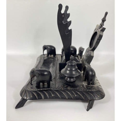 53 - An unusual ebony desk tidy complete with 5 carved elephants 25x18cm#72