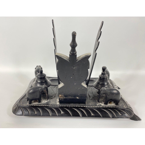 53 - An unusual ebony desk tidy complete with 5 carved elephants 25x18cm#72